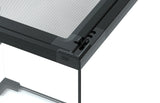 Close-up of black reptile or amphibian habitat tank with secure mesh lid and ventilation slots