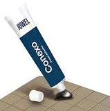 Juwel Conexo aquarium adhesive sealant tube applying grey glue onto a tile surface