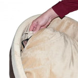 Hand adjusting plush, circular heated cat bed in sage color with soft covering.