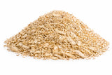 Pile of natural hemp reptile bedding substrate on a white background